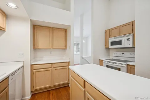 a kitchen with a stove microwave and sink