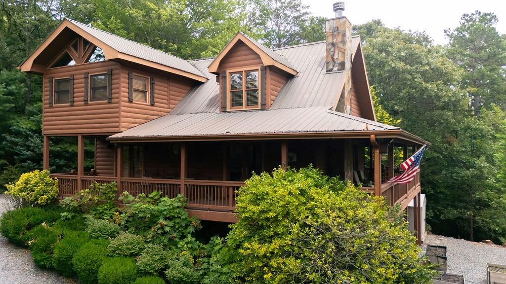 120 Foxfire Road Blue Ridge, GA 30513 - Photo 1 of 55 a front view of a house with garden