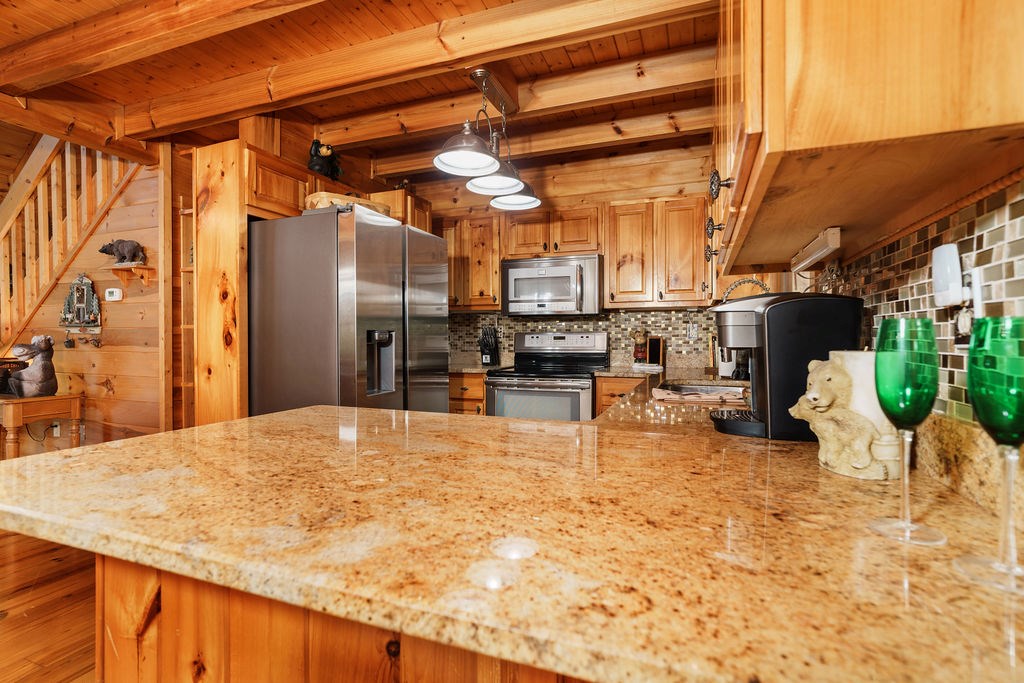 120 Foxfire Road Blue Ridge, GA 30513 - Photo 15 of 55 a view of a patio with a table and chairs