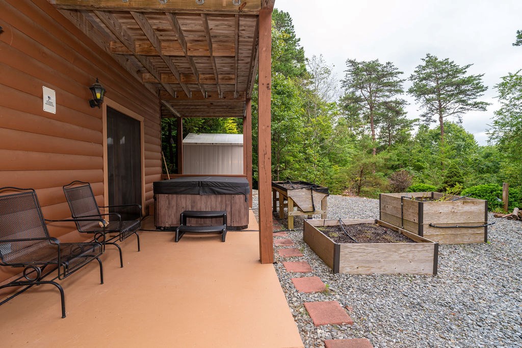 120 Foxfire Road Blue Ridge, GA 30513 - Photo 19 of 55 a balcony with furniture and a potted plant