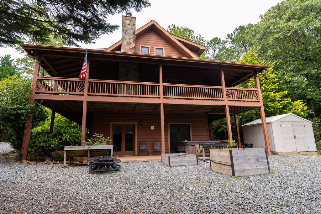 120 Foxfire Road Blue Ridge, GA 30513 - Photo 20 of 55 a view of a house with backyard porch and sitting area