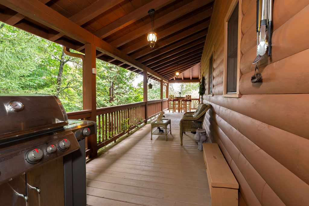 120 Foxfire Road Blue Ridge, GA 30513 - Photo 25 of 55 a living room with patio furniture and a floor to ceiling window