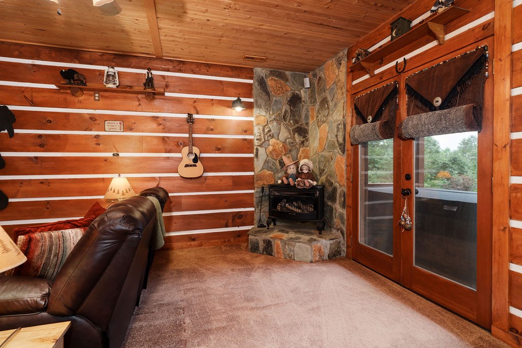 120 Foxfire Road Blue Ridge, GA 30513 - Photo 28 of 55 a view of walk in closet with clothes and shoes