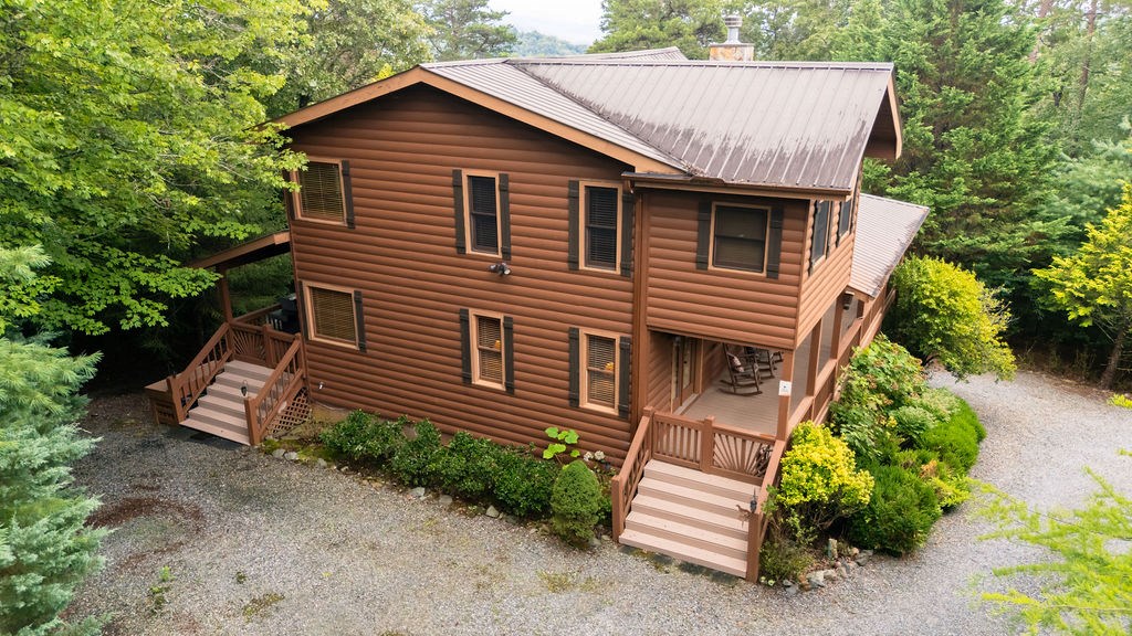 120 Foxfire Road Blue Ridge, GA 30513 - Photo 30 of 55 a front view of a house with a garden