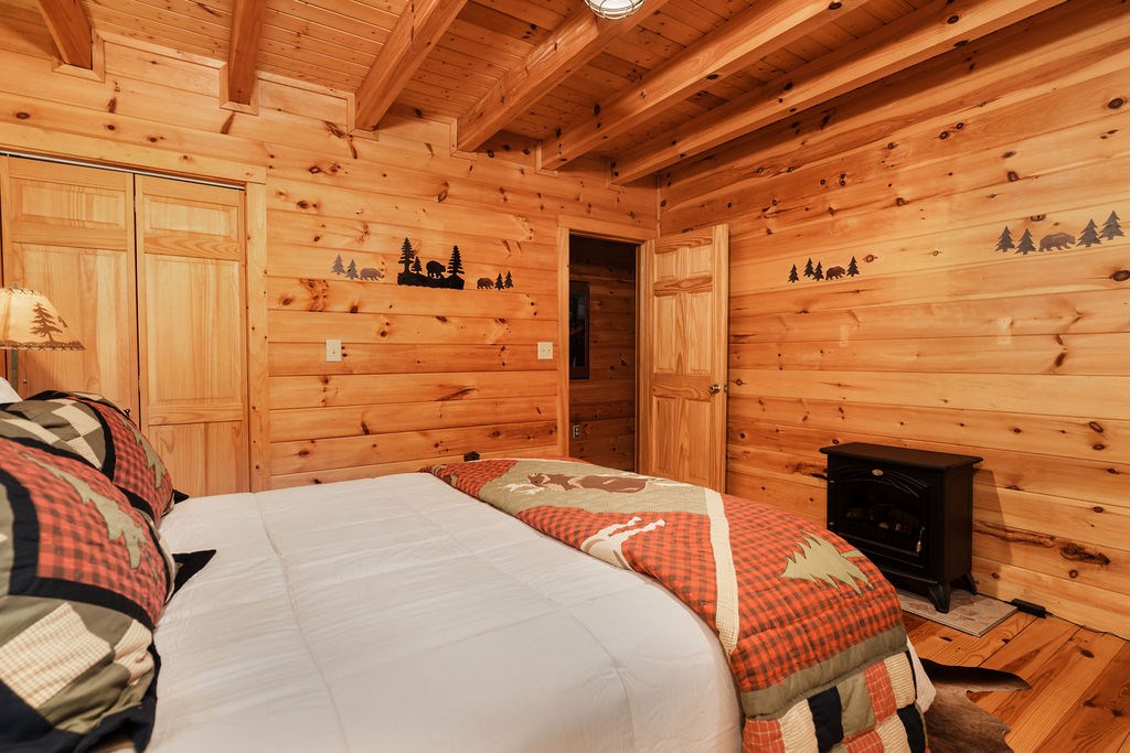 120 Foxfire Road Blue Ridge, GA 30513 - Photo 39 of 55 a bedroom with a bed and a dresser