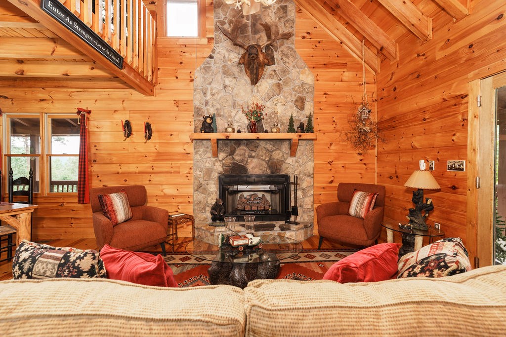 120 Foxfire Road Blue Ridge, GA 30513 - Photo 5 of 55 a bedroom with furniture and a fireplace