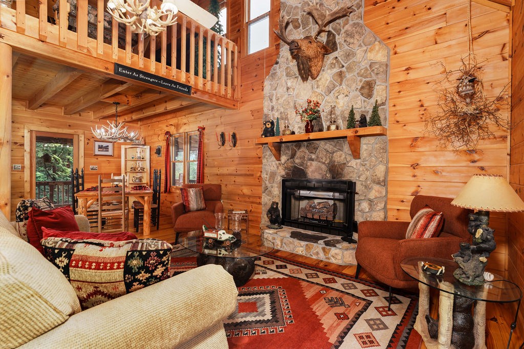 120 Foxfire Road Blue Ridge, GA 30513 - Photo 6 of 55 a living room with furniture a fireplace and a flat screen tv