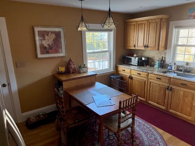 a dining room with furniture and window