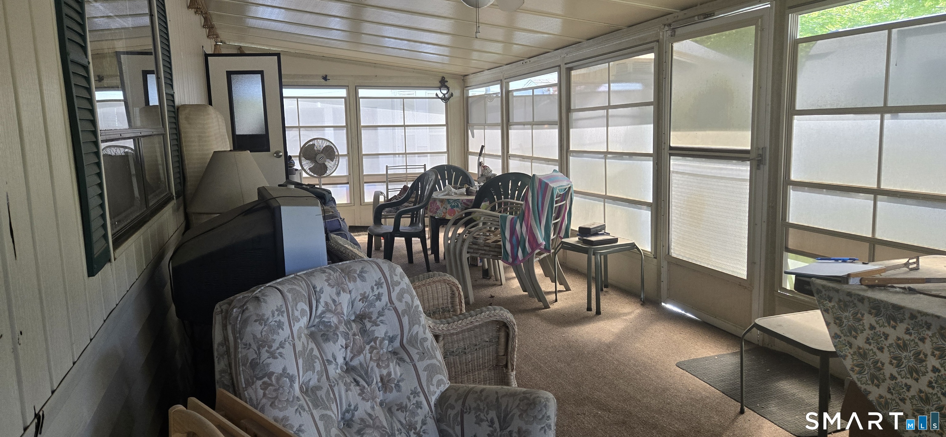 306 Old Colchester Road, Unit 126 Salem, CT 06420 - Photo 10 of 22 a view of a dining room with furniture window and outside view