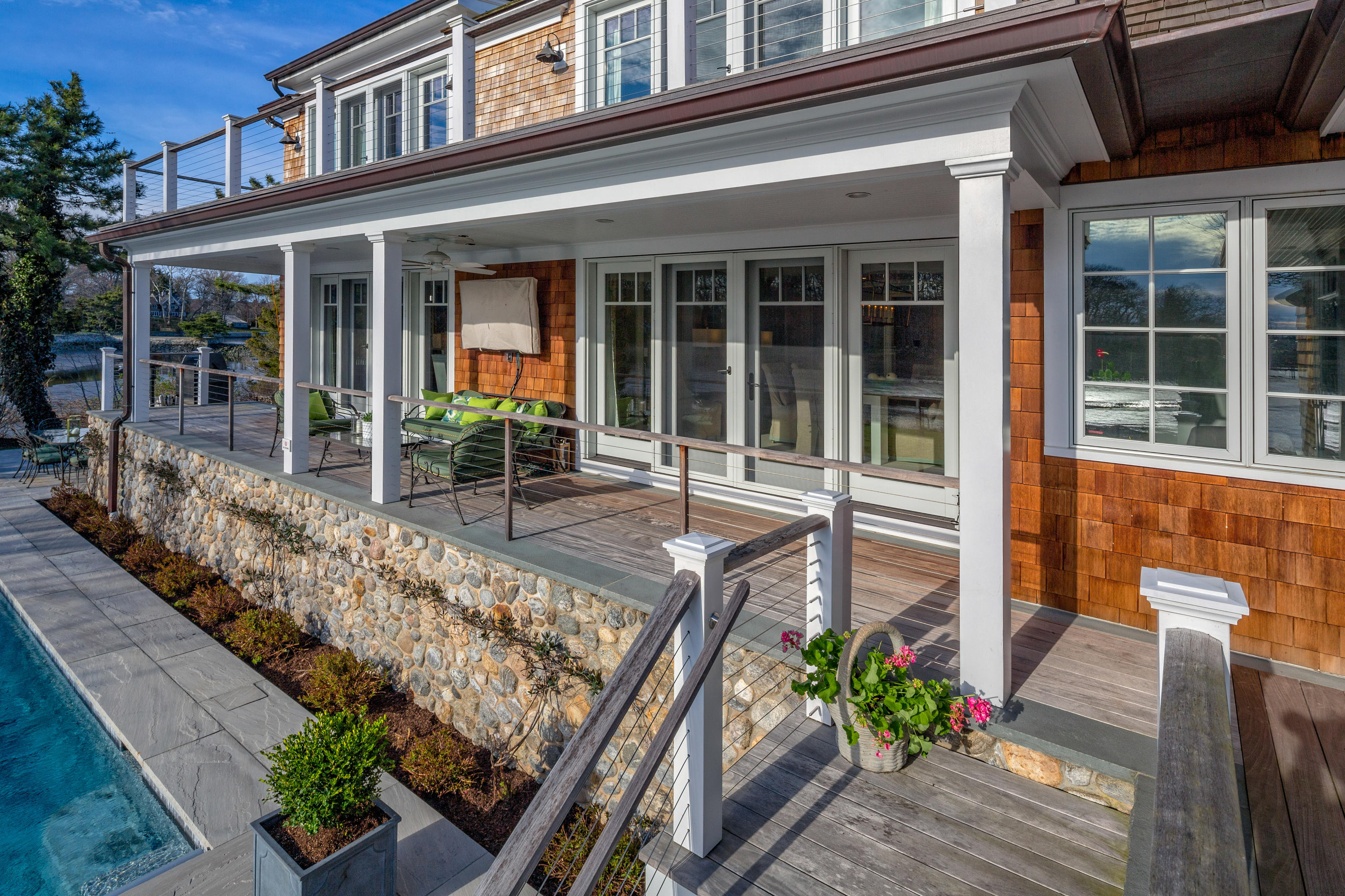 6 Contentment Island Road Darien, CT 06820 - Photo 15 of 40 front view of a house with a patio