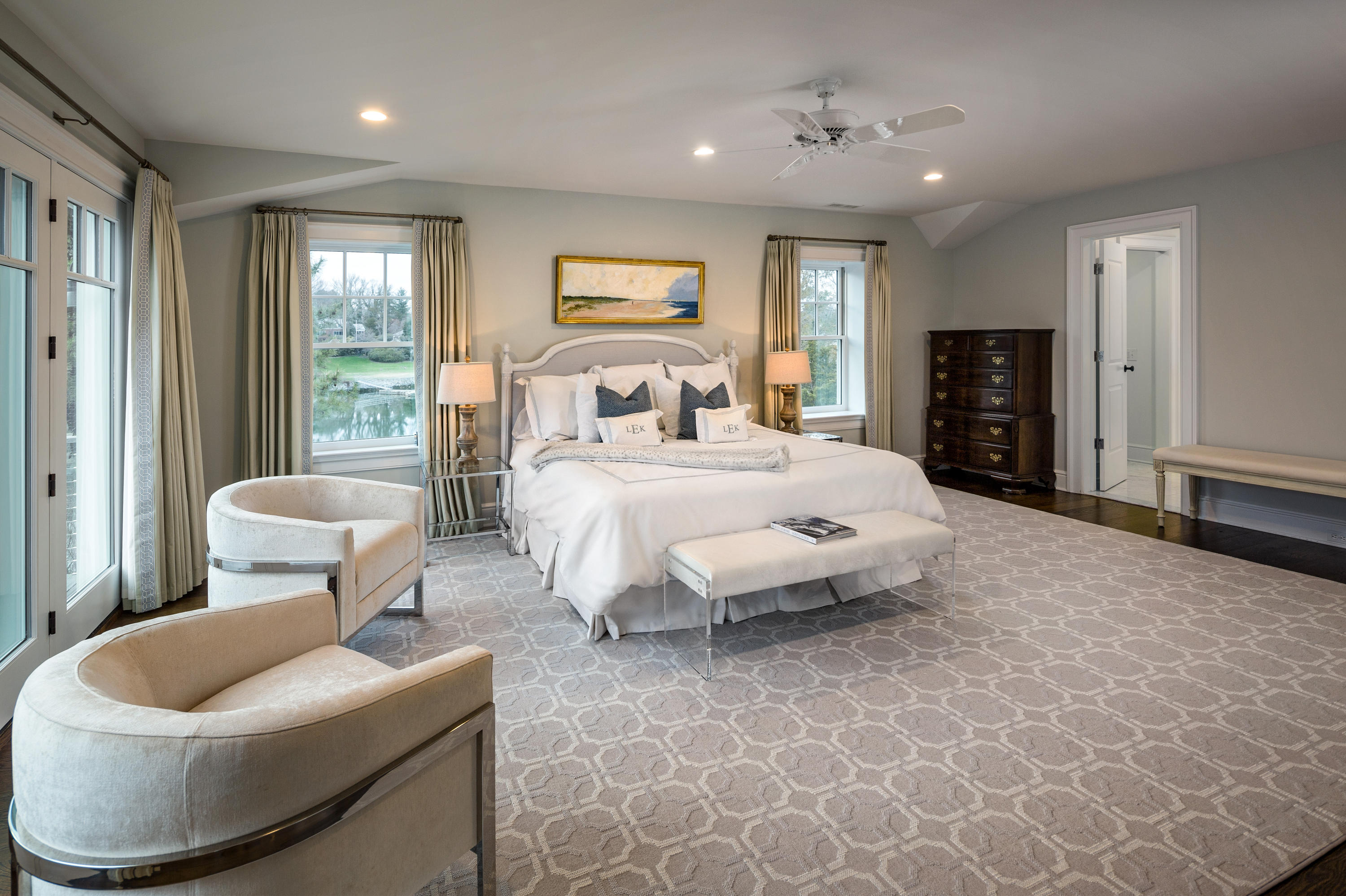 6 Contentment Island Road Darien, CT 06820 - Photo 25 of 40 a spacious bedroom with a bed and glass windows