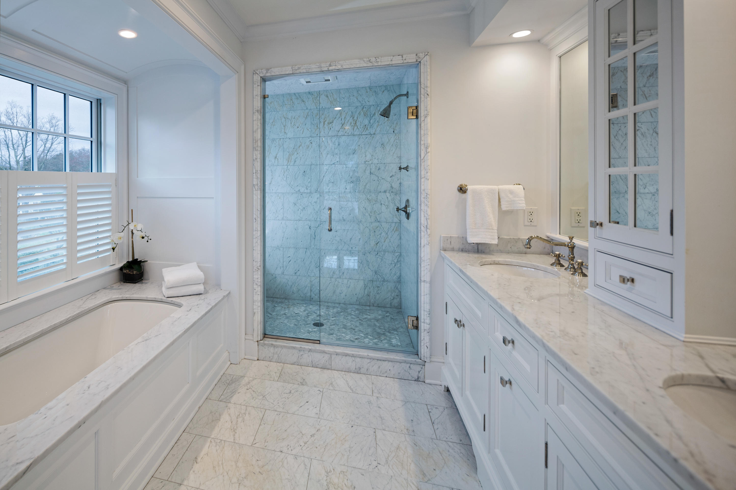 6 Contentment Island Road Darien, CT 06820 - Photo 29 of 40 a spacious bathroom with a granite countertop tub sink a shower and a mirror