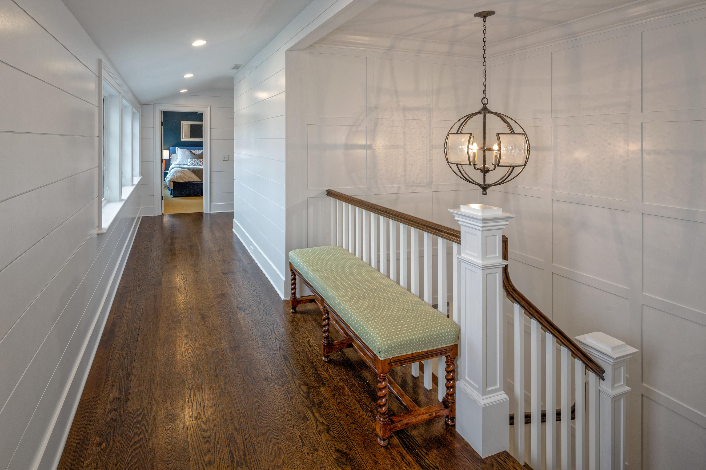 6 Contentment Island Road Darien, CT 06820 - Photo 33 of 40 a view of a hallway with wooden floor and staircase