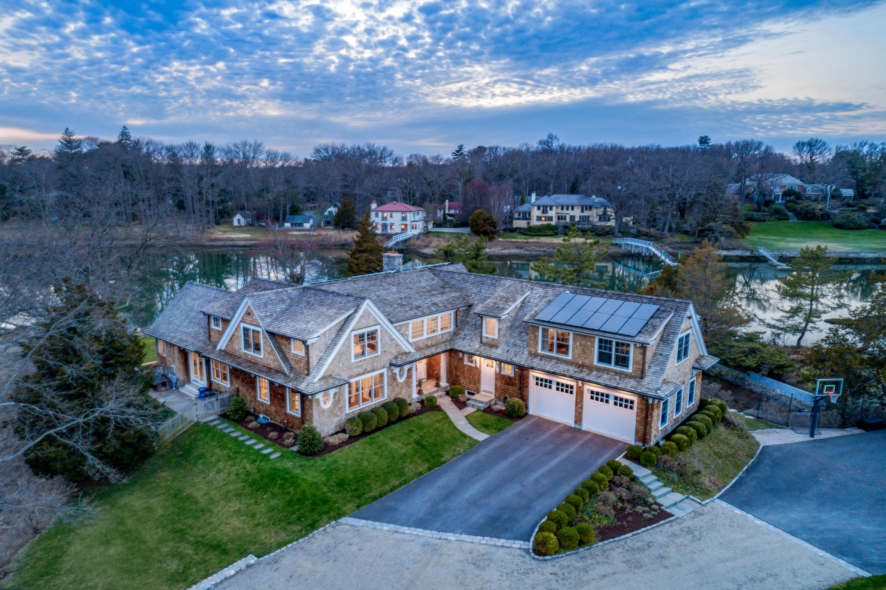 6 Contentment Island Road Darien, CT 06820 - Photo 4 of 40 an aerial view of a house with a garden and trees