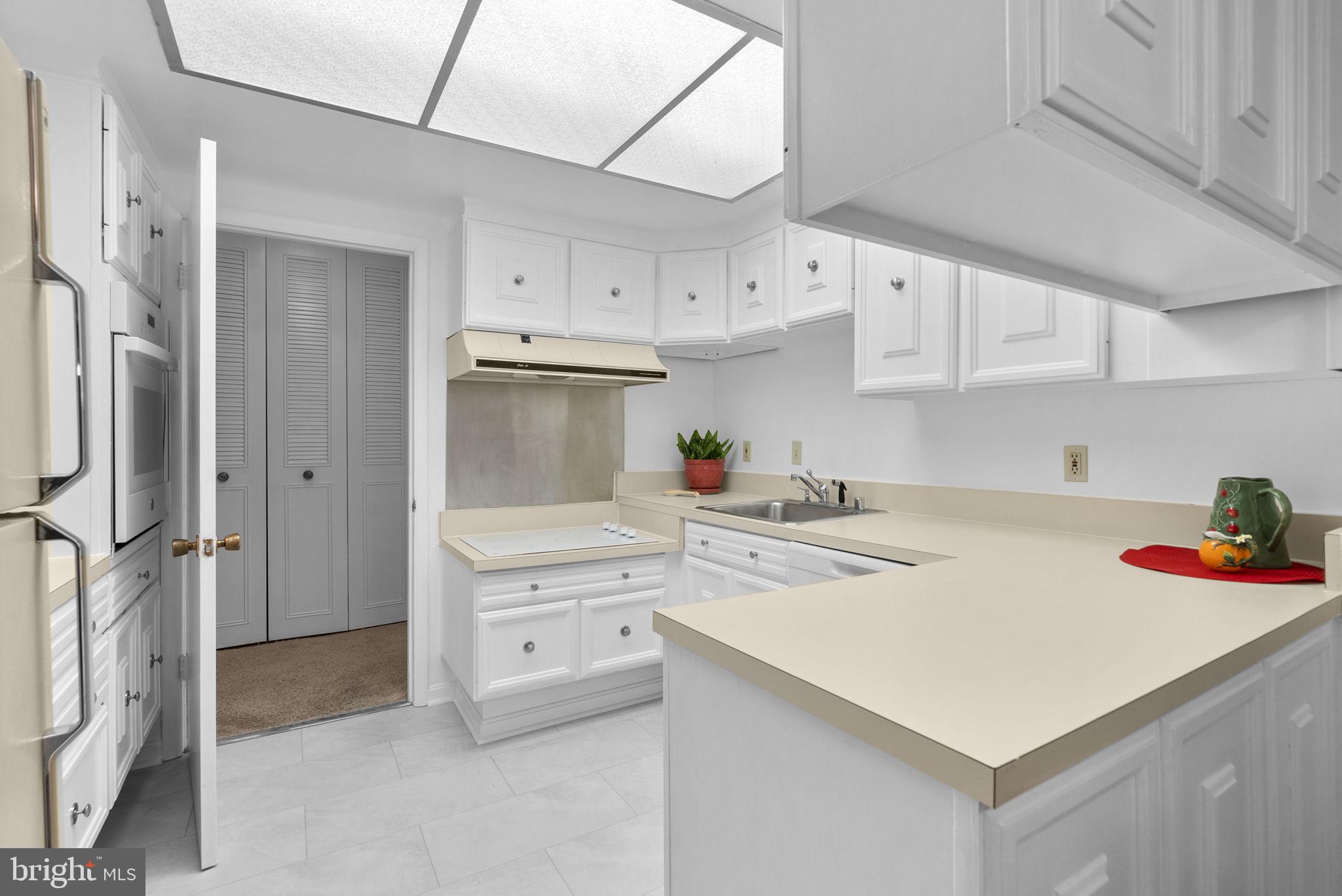 3382 Chiswick Court, Unit 512D Silver Spring, MD 20906 - Photo 11 of 50 Bright kitchen w/ loads of cabinets & counter top!