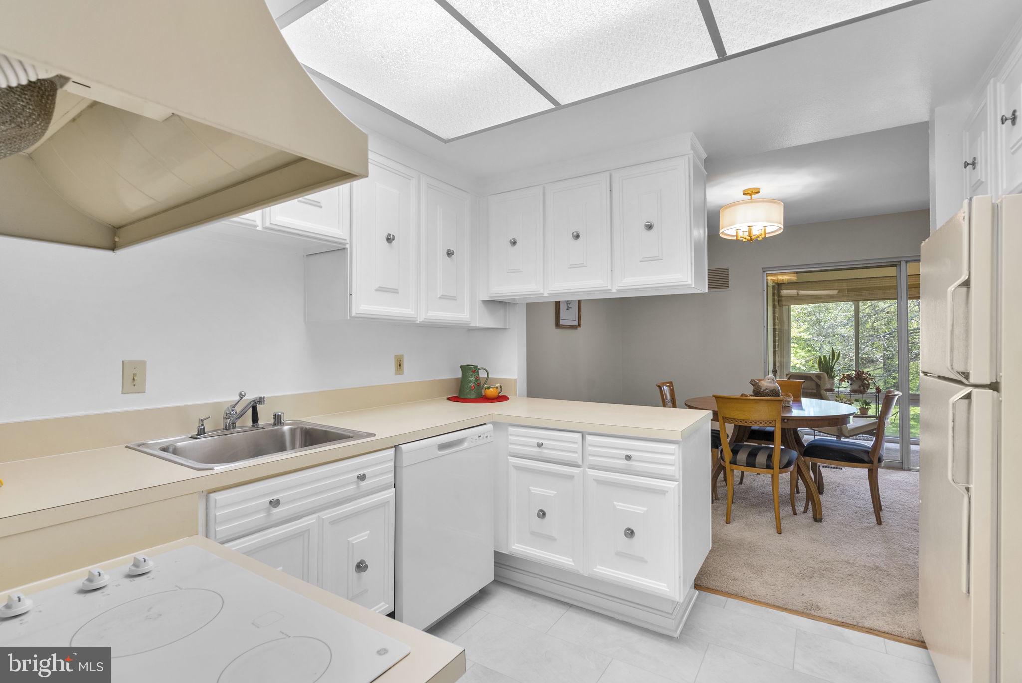 3382 Chiswick Court, Unit 512D Silver Spring, MD 20906 - Photo 14 of 50 Kitchen opens to the dining room!