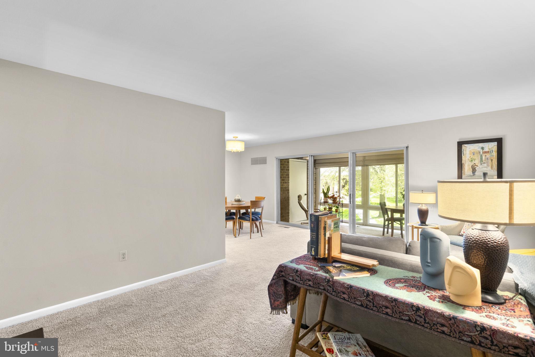 3382 Chiswick Court, Unit 512D Silver Spring, MD 20906 - Photo 5 of 50 Living room opens to the sun room and dining room!
