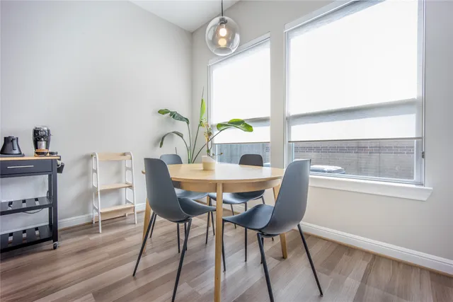 a view of living room with furniture and a potted plant