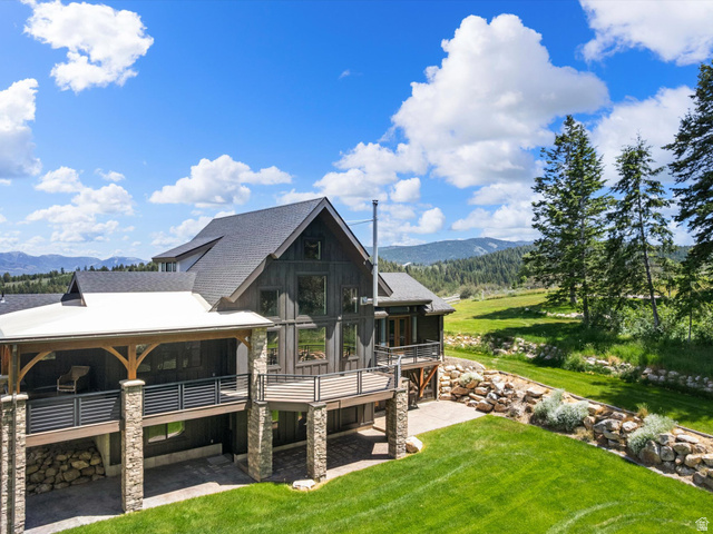 1225 Old Oregon Road Soda Springs, ID 83276 - Photo 60 of 67 Contemporary two-story residence featuring a dark wood-finish exterior, expansive multi-level decking, and stone column accents