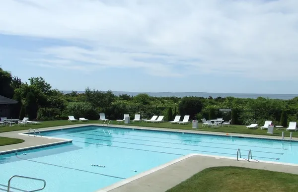a view of swimming pool with yard
