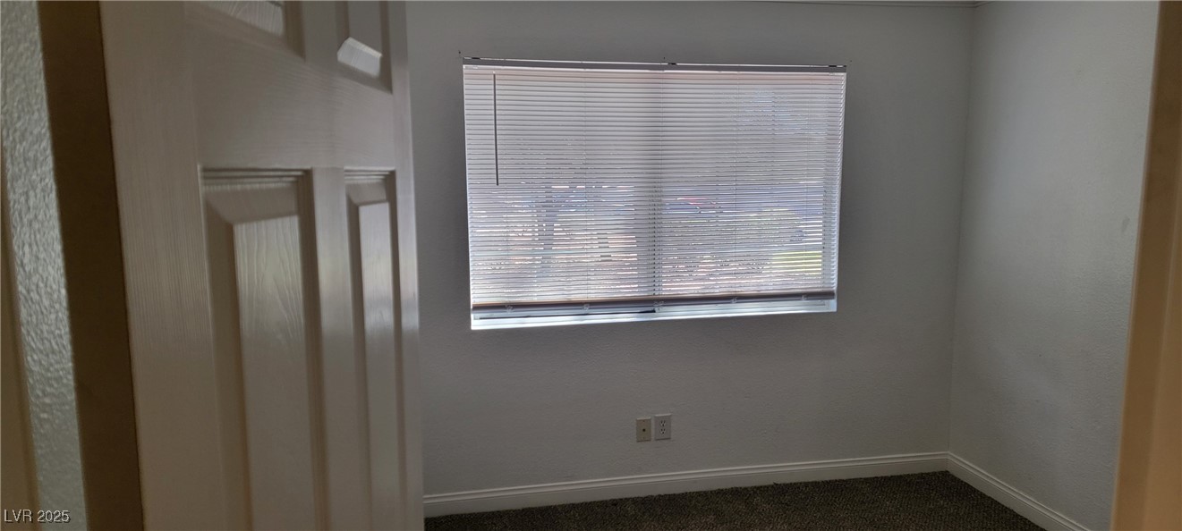 2750 South Durango Drive, Unit 1072 Las Vegas, NV 89117 - Photo 21 of 23 Spare room featuring plenty of natural light and d