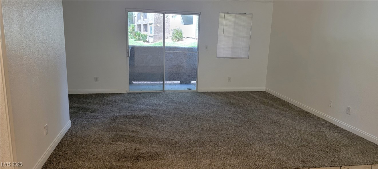 2750 South Durango Drive, Unit 1072 Las Vegas, NV 89117 - Photo 9 of 23 Carpeted spare room with baseboards