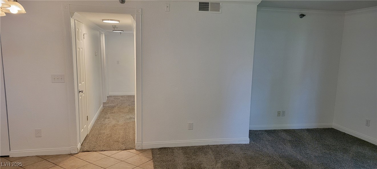 2750 South Durango Drive, Unit 1072 Las Vegas, NV 89117 - Photo 10 of 23 Unfurnished room featuring light carpet, light til