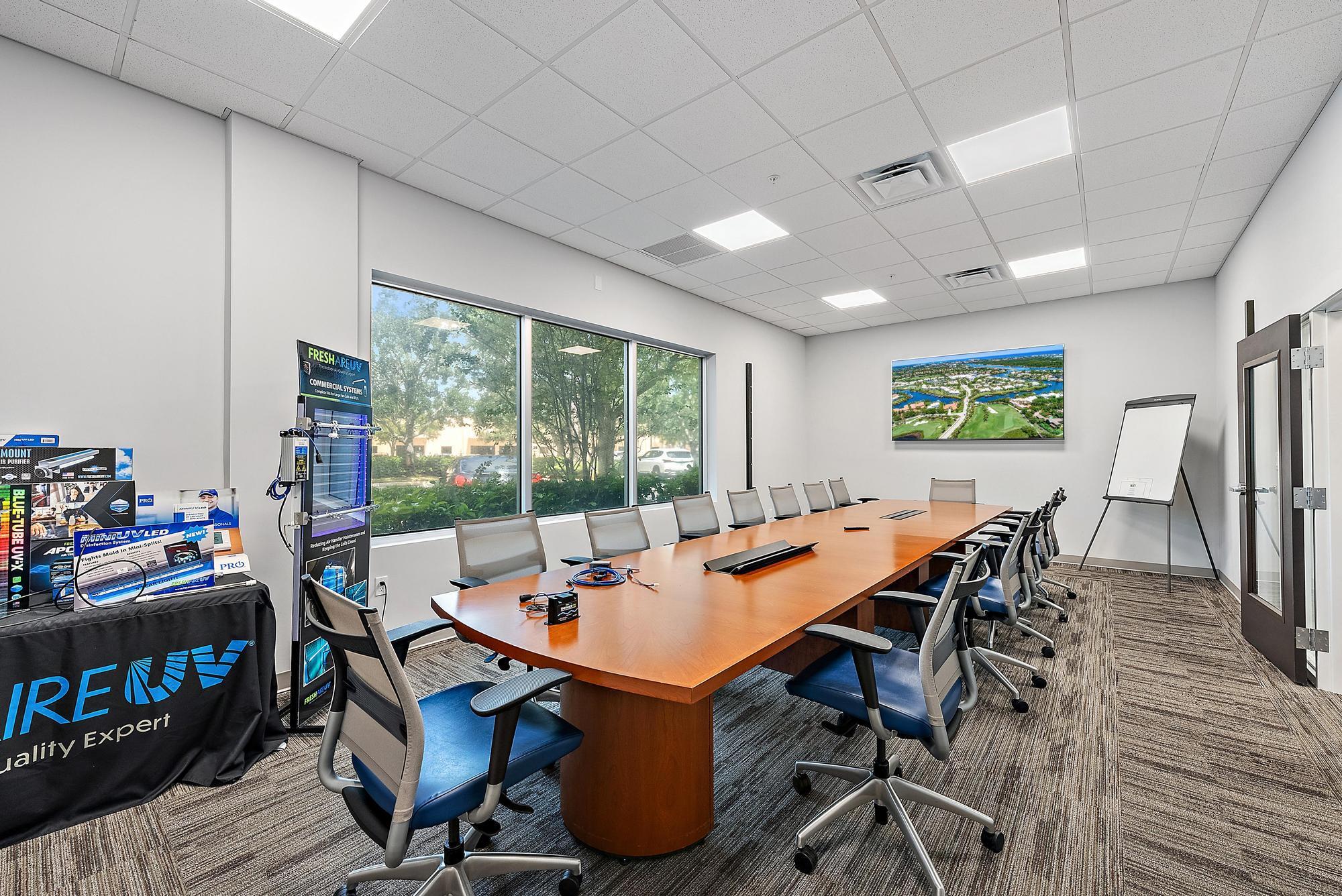 3126 Jupiter Park Drive Jupiter, FL 33458 - Photo 13 of 34 a view of a dining room with furniture window and wooden floor