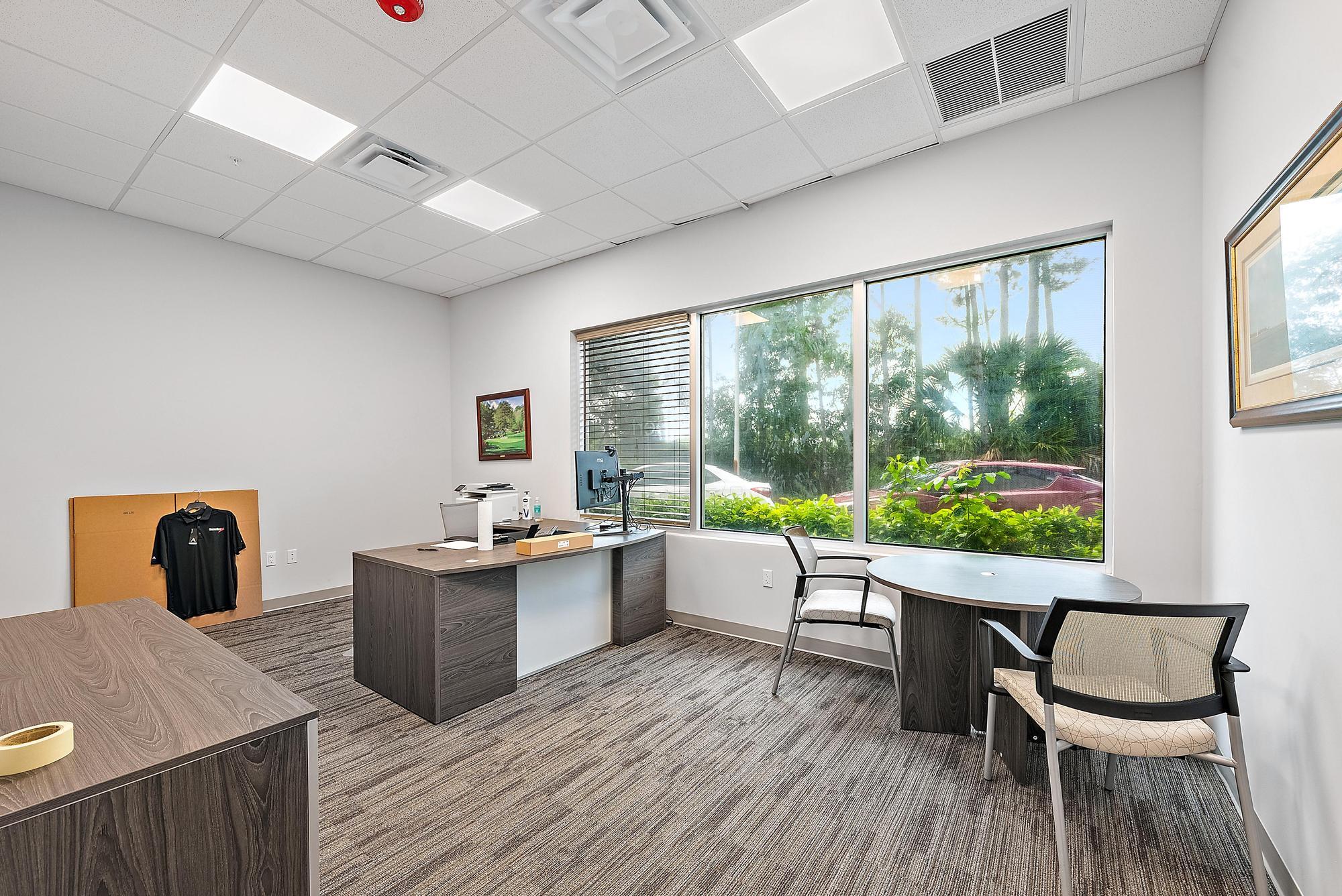 3126 Jupiter Park Drive Jupiter, FL 33458 - Photo 14 of 34 a living room with furniture and a large window