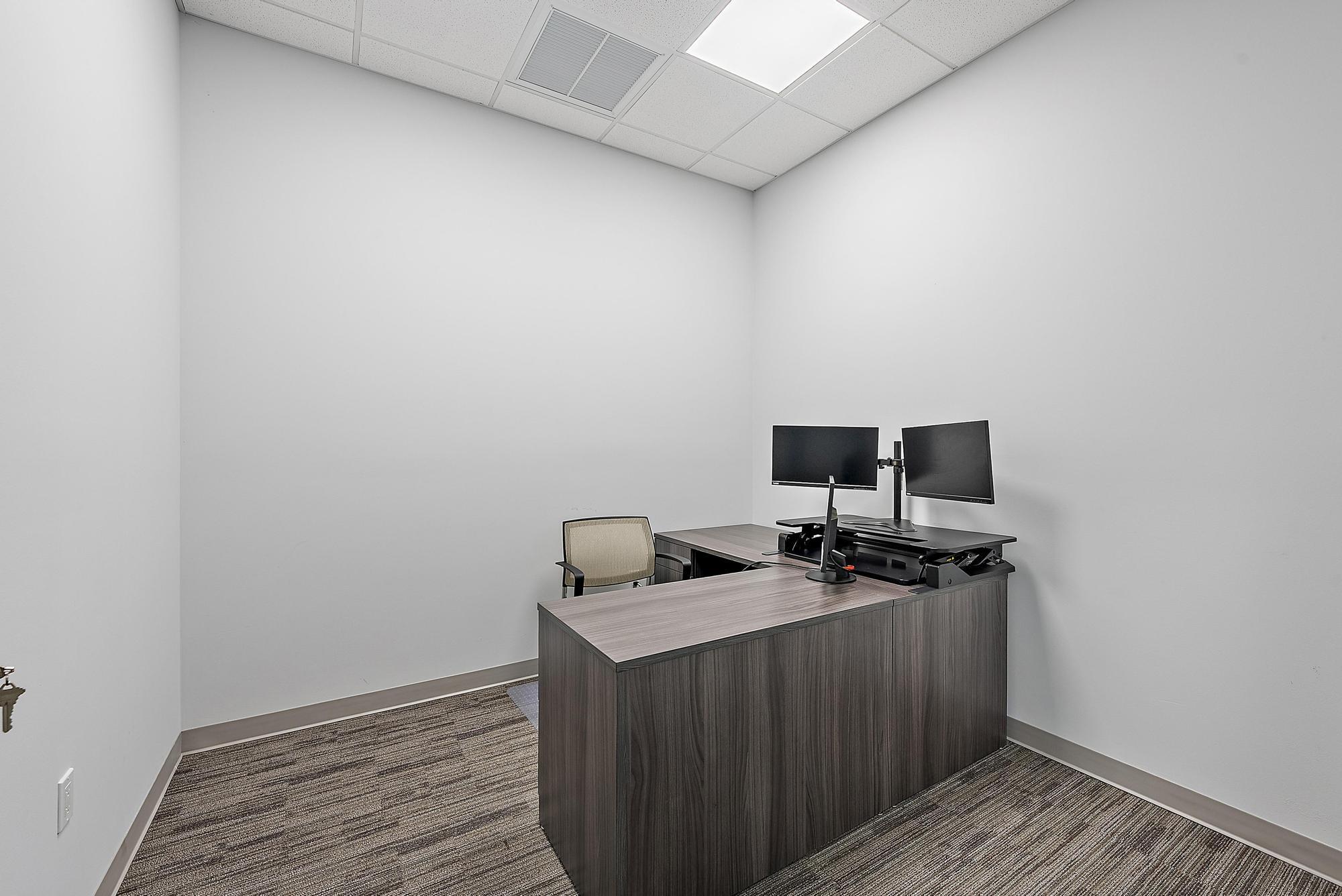 3126 Jupiter Park Drive Jupiter, FL 33458 - Photo 15 of 34 a view of a workspace with wooden floor