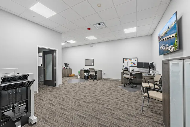 a kitchen with stainless steel appliances a refrigerator sink and microwave