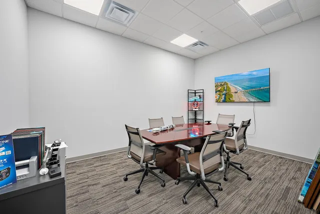 a kitchen with stainless steel appliances a stove and wooden floor