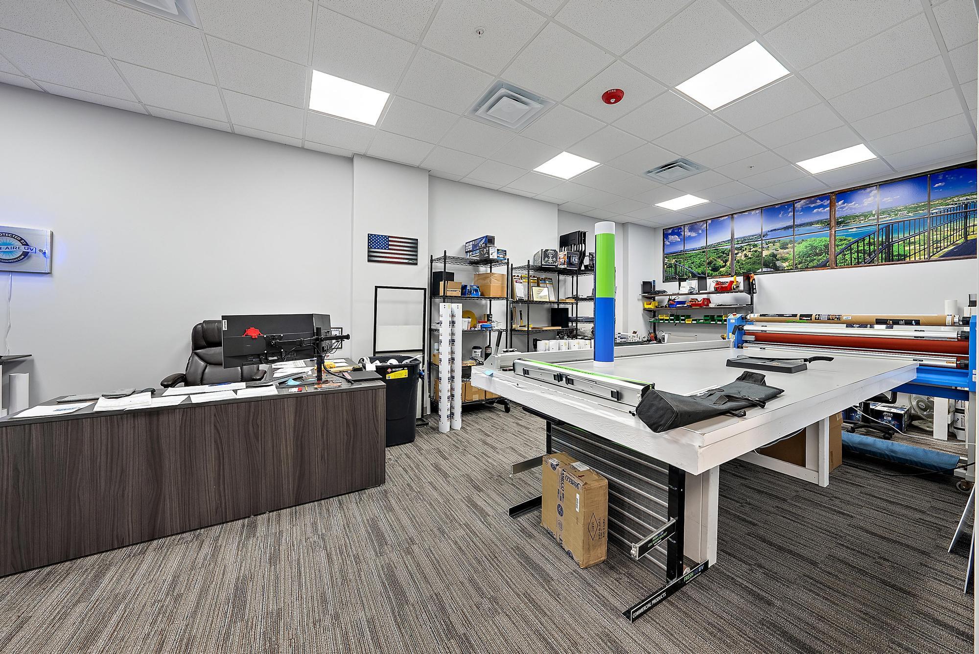 3126 Jupiter Park Drive Jupiter, FL 33458 - Photo 27 of 34 a living room with furniture and a wooden floor