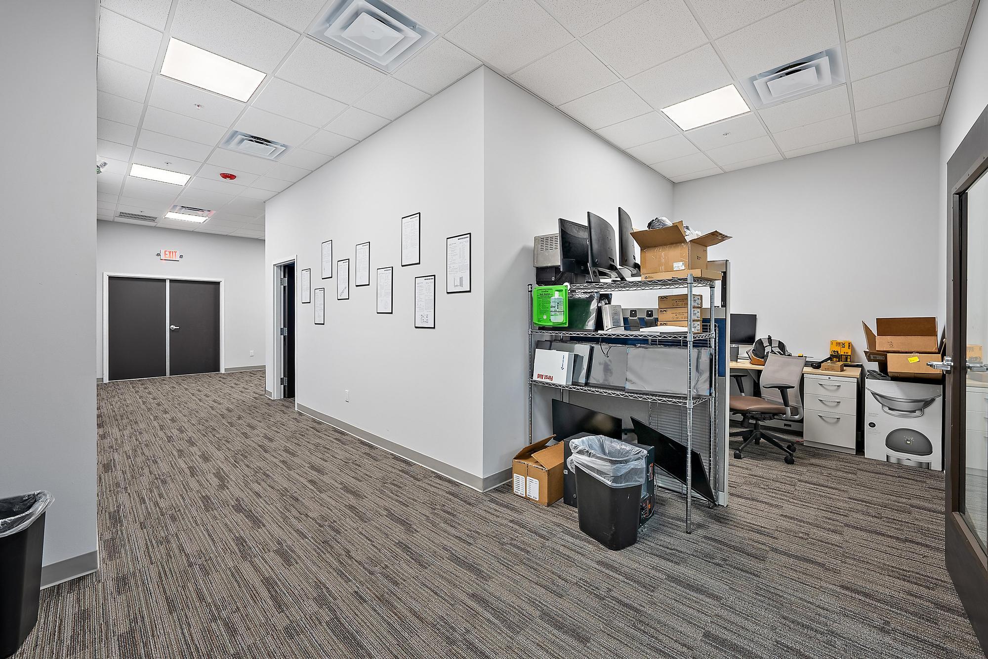 3126 Jupiter Park Drive Jupiter, FL 33458 - Photo 29 of 34 a kitchen with stainless steel appliances a stove and wooden floor