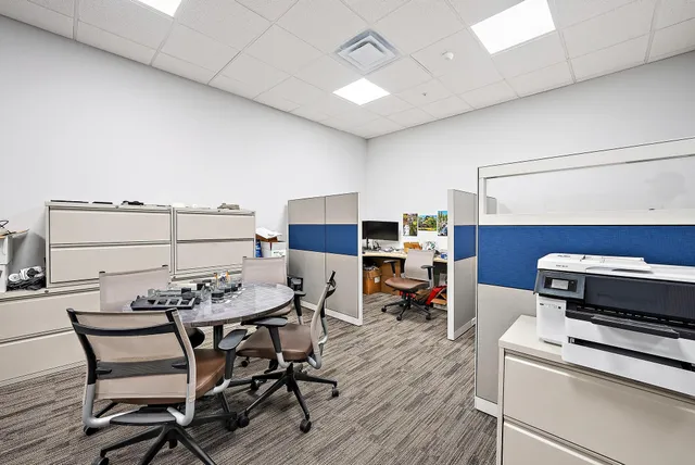 a room with lots of furniture and a flat screen tv