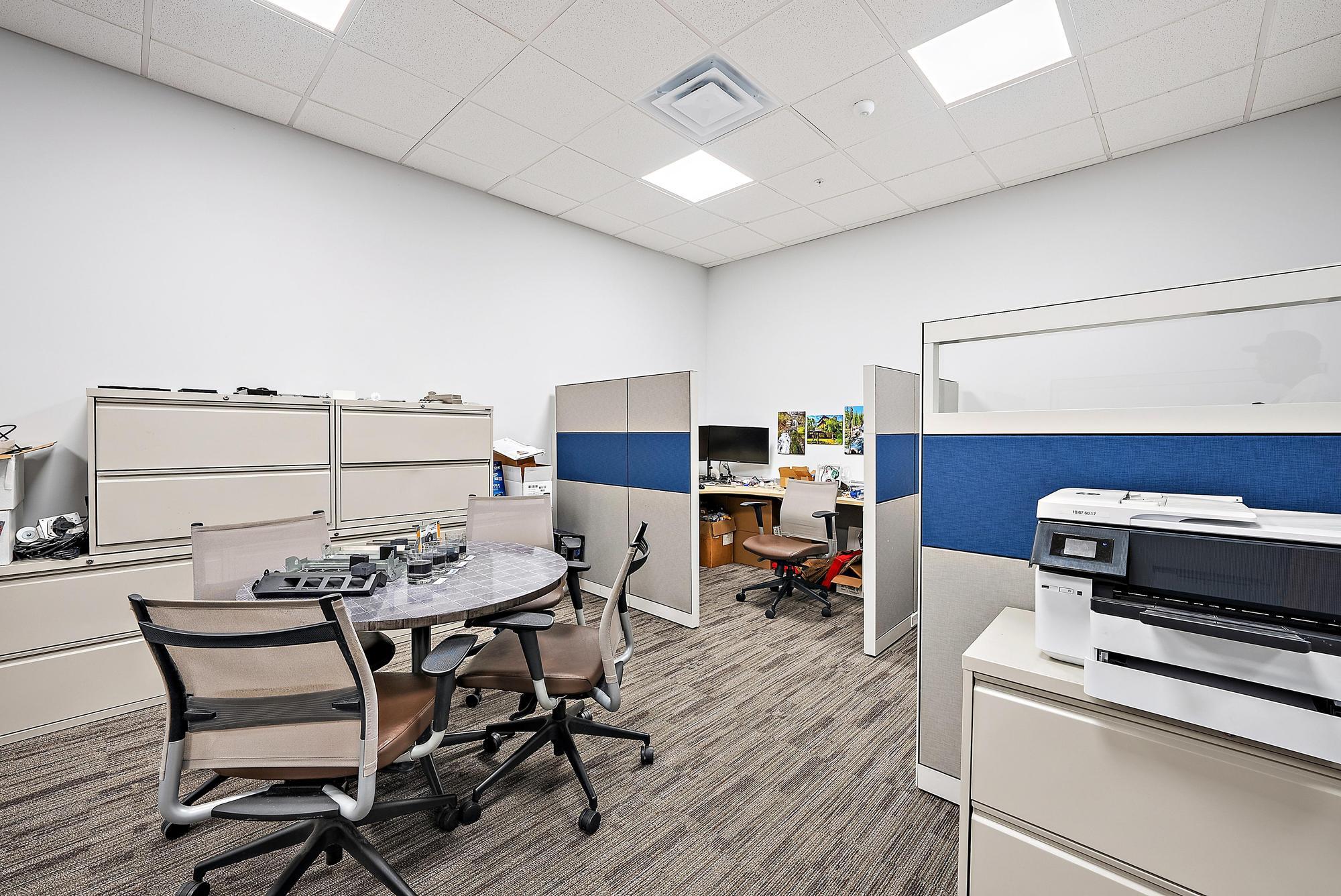 3126 Jupiter Park Drive Jupiter, FL 33458 - Photo 30 of 34 a living room with furniture a flat screen tv and a stove with wooden floor