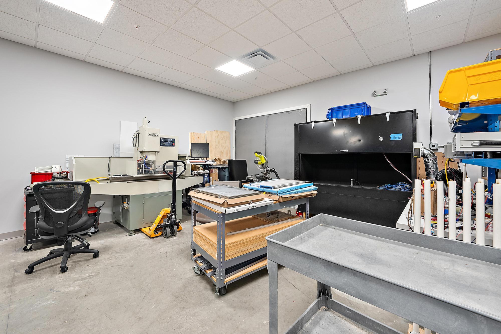 3126 Jupiter Park Drive Jupiter, FL 33458 - Photo 32 of 34 a living room with furniture and a flat screen tv