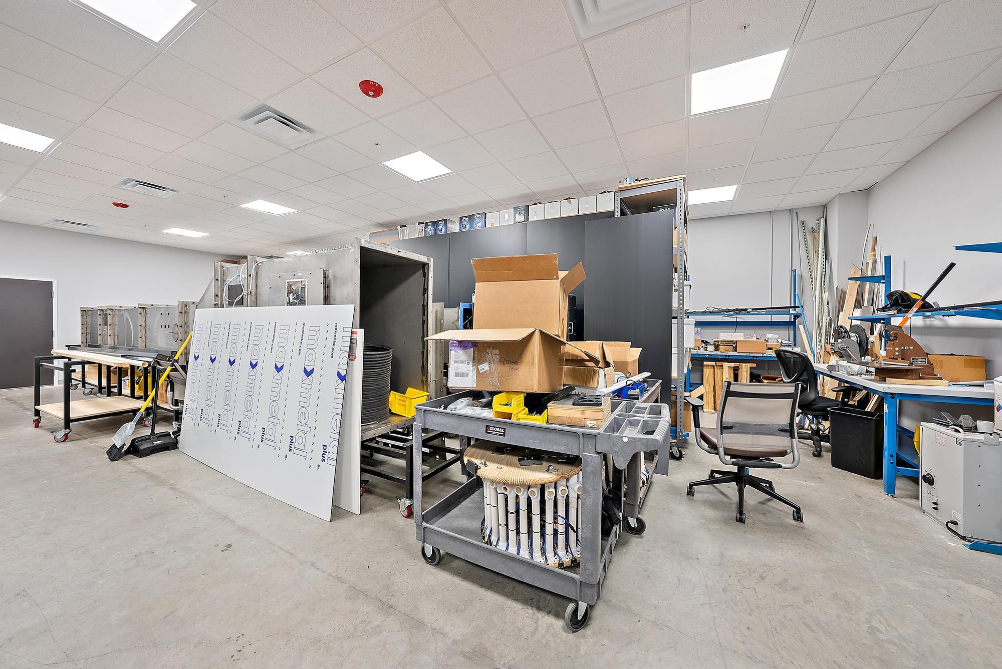 3126 Jupiter Park Drive Jupiter, FL 33458 - Photo 33 of 34 a room with lots of furniture and a flat screen tv