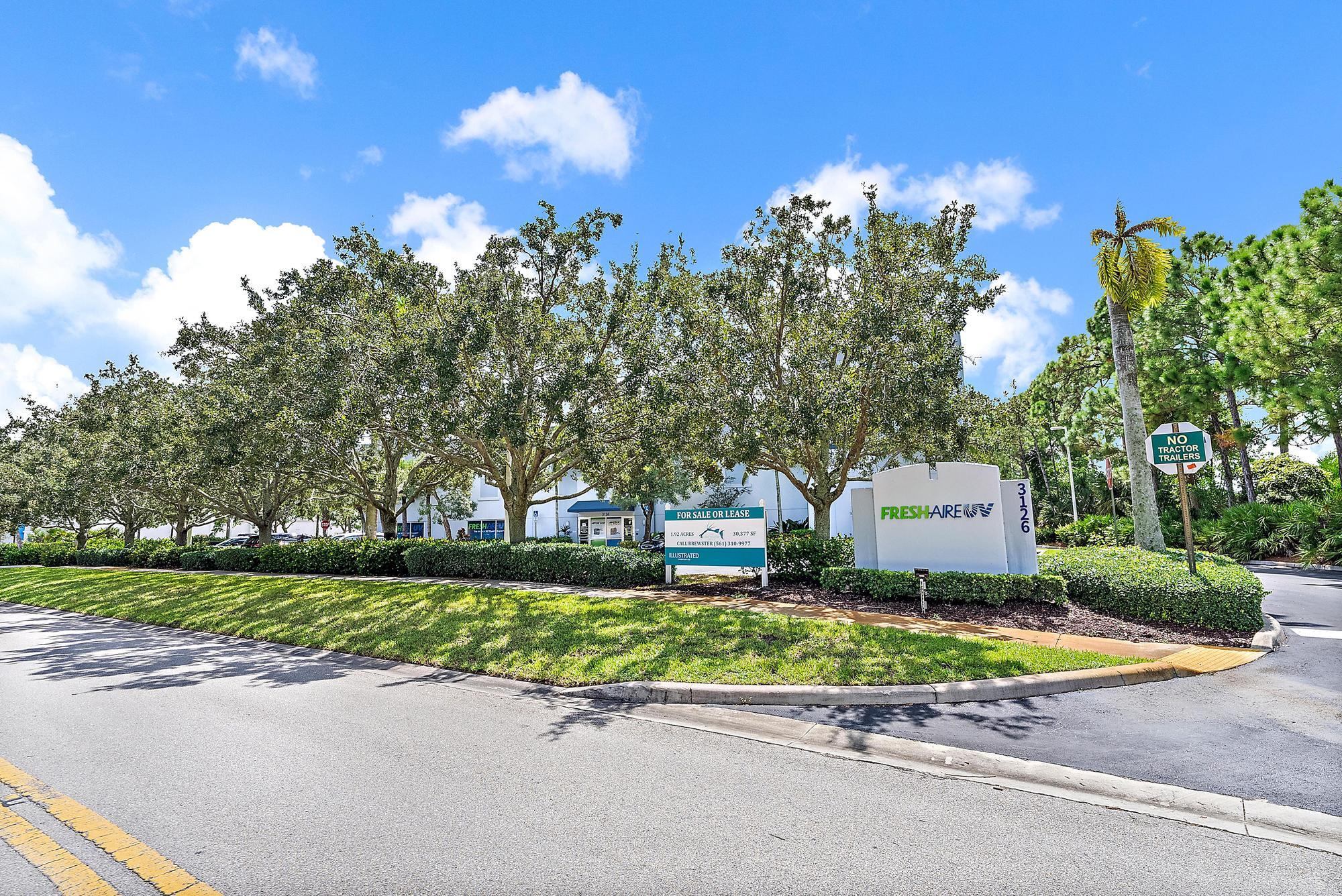3126 Jupiter Park Drive Jupiter, FL 33458 - Photo 34 of 34 a view of a street with a house in the background