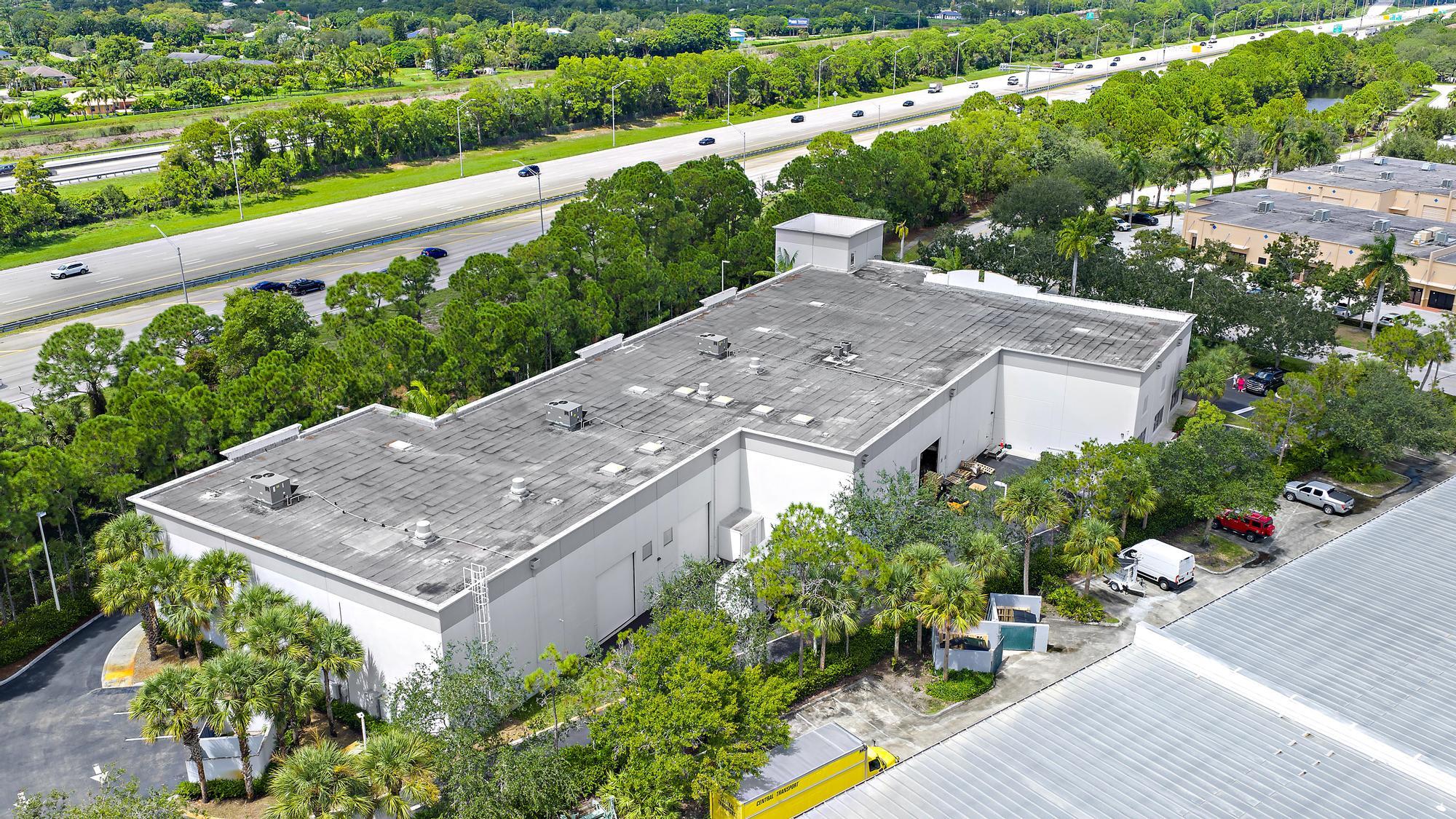 3126 Jupiter Park Drive Jupiter, FL 33458 - Photo 5 of 34 an aerial view of a house with a garden