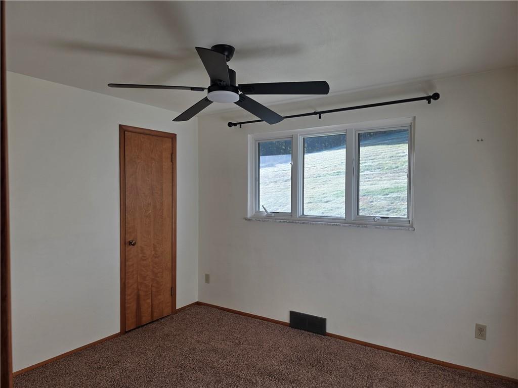 196 Valley Road Eighty Four, PA 15330 - Photo 12 of 23 an empty room with windows and ceiling fan