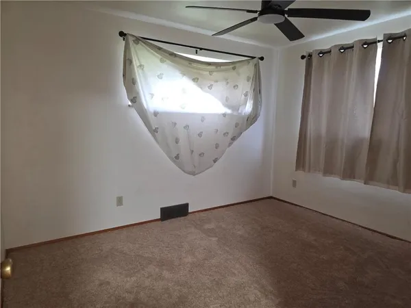 en empty room with windows