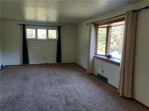 an empty room with windows