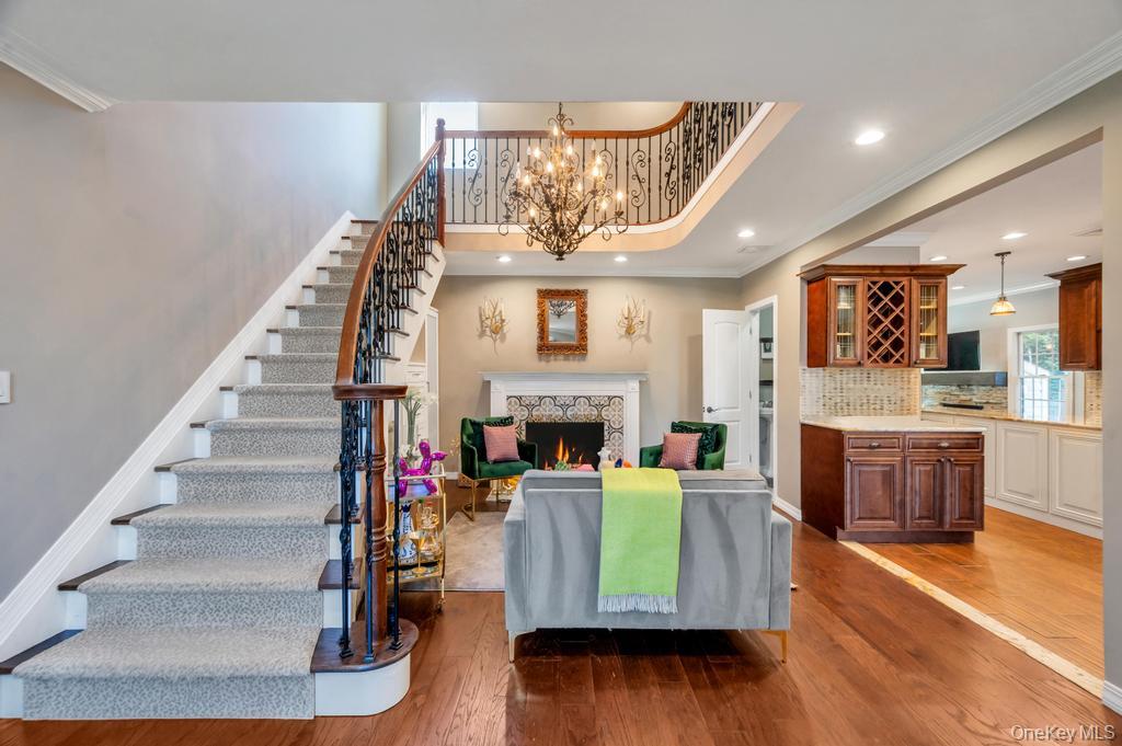 357 Wynsum Avenue Merrick, NY 11566 - Photo 6 of 40 a living room with furniture and a fireplace