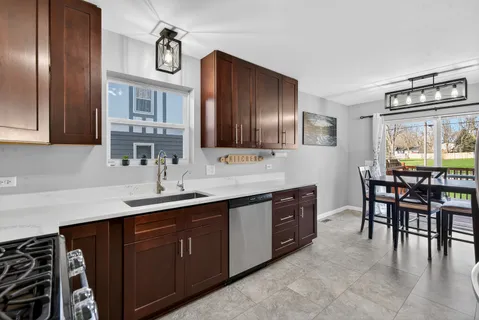 a kitchen with a table and chairs in it