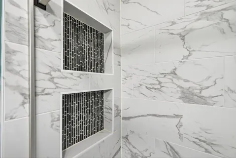 a bathroom with a shower and a fireplace