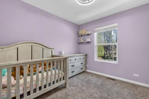 a bedroom with furniture and windows