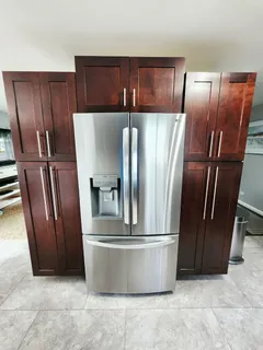 a view of a refrigerator with wooden fence