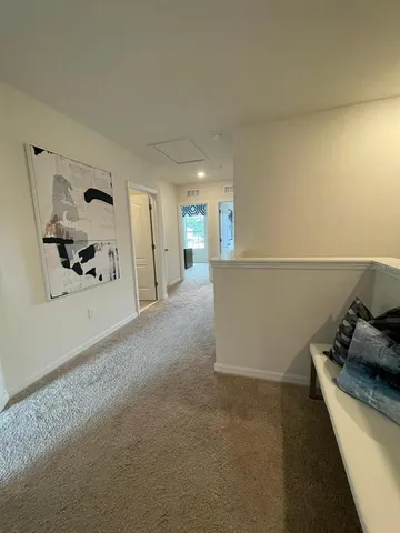 a view of a storage & utility room with two washing machine