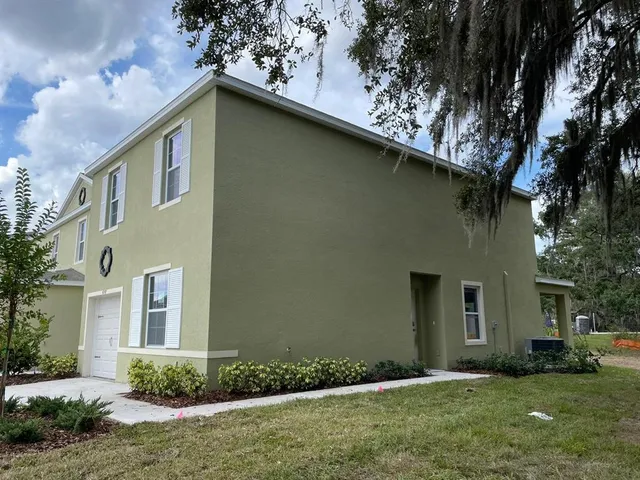 a view of a backyard of the house